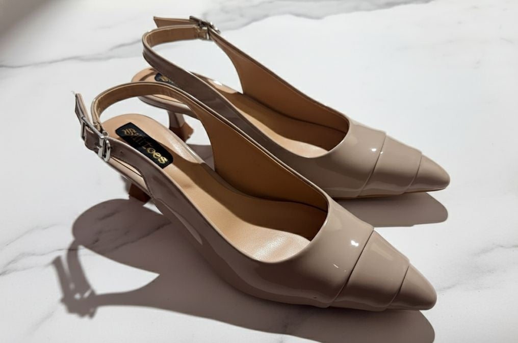Pointed-toe slingback kitten heels.